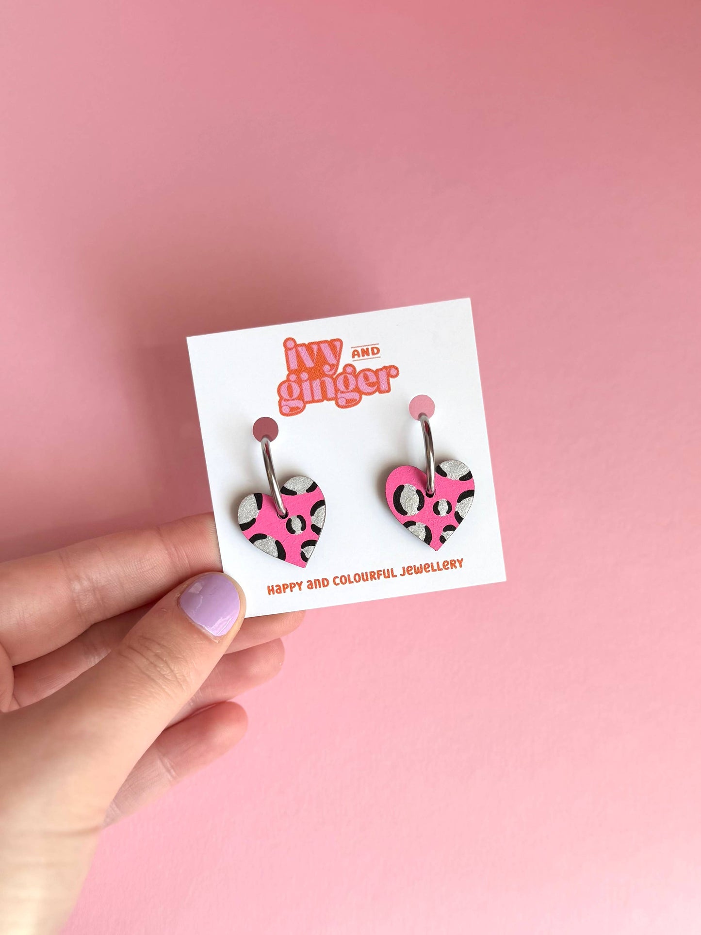 Bright pink and silver leopard print heart hoop earrings